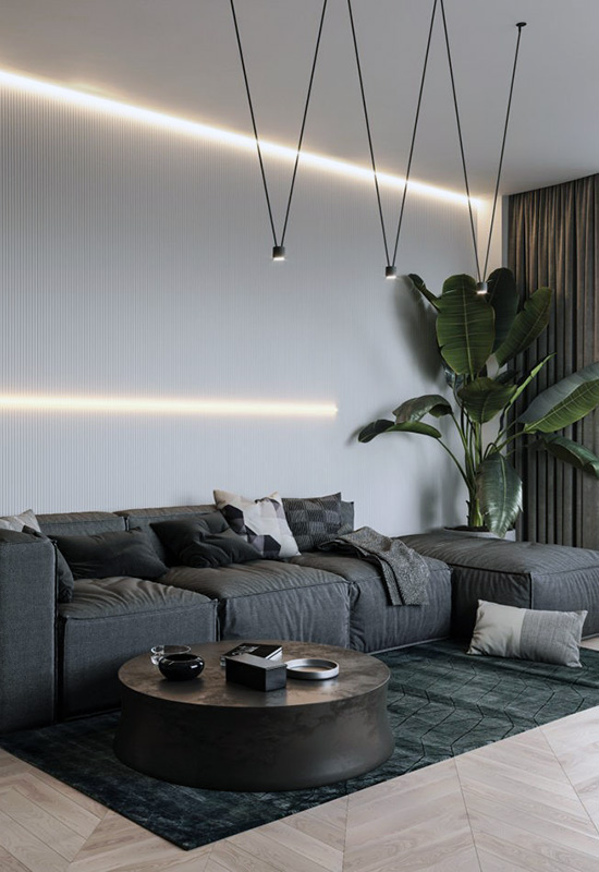 Відкрита вітальня з навісними люстрами та світлими стінами