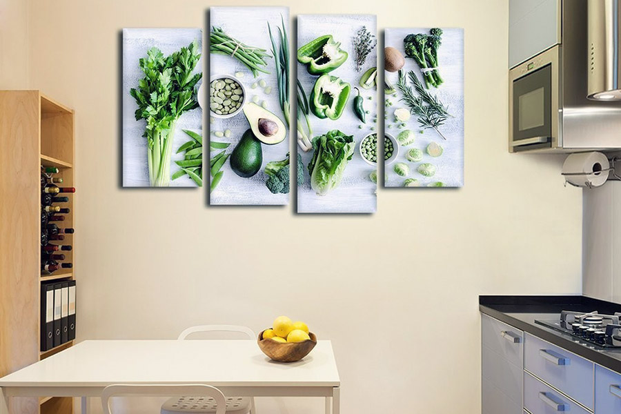 Стильне оформлення кухонної стіни біля столу за допомогою картин