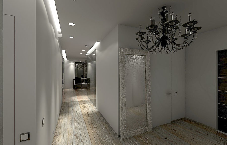 Освітлювальні прилади різного дизайну в інтер'єрі вузького передпокою