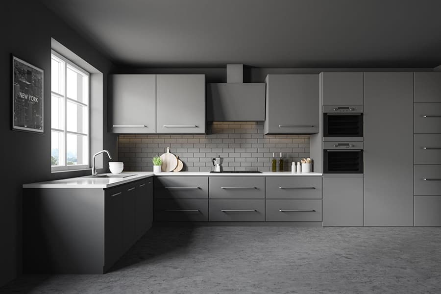 Кутове планування кухні у сірих кольорах